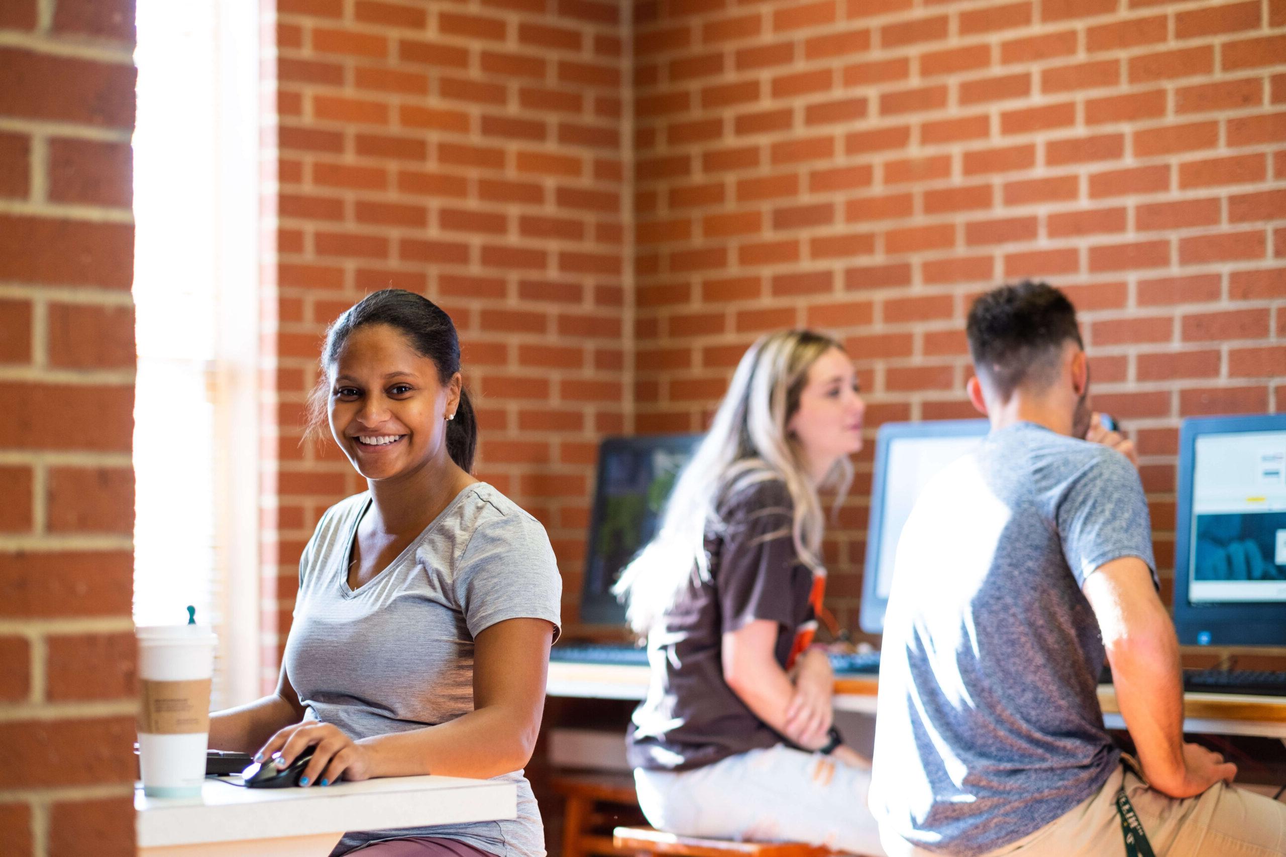 college student at computer in franks hall