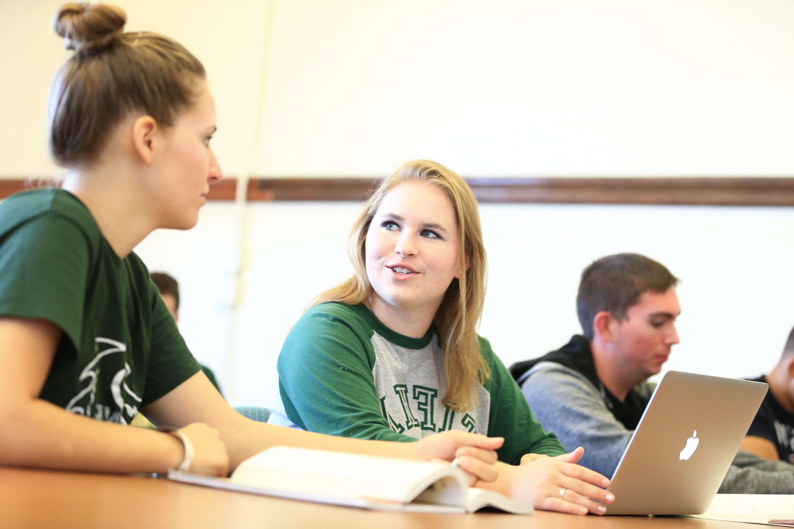 college students in class with laptop